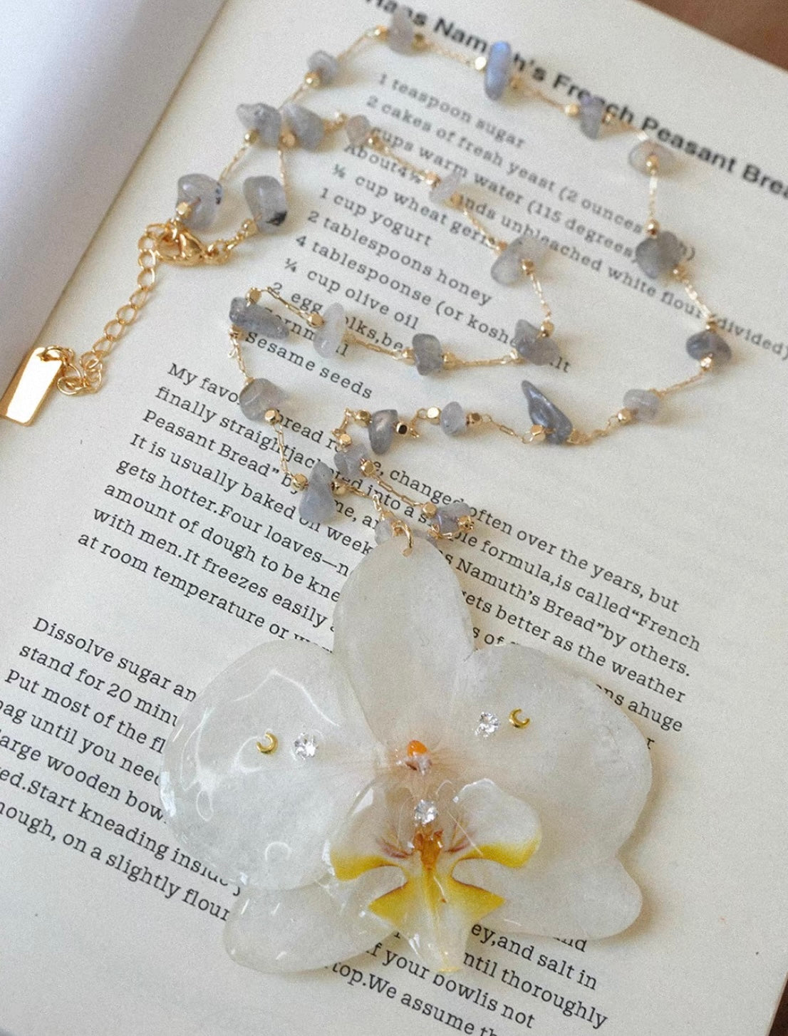 Ivory white preserved orchid pendant necklace with gold-tone chain by Terra Decode
