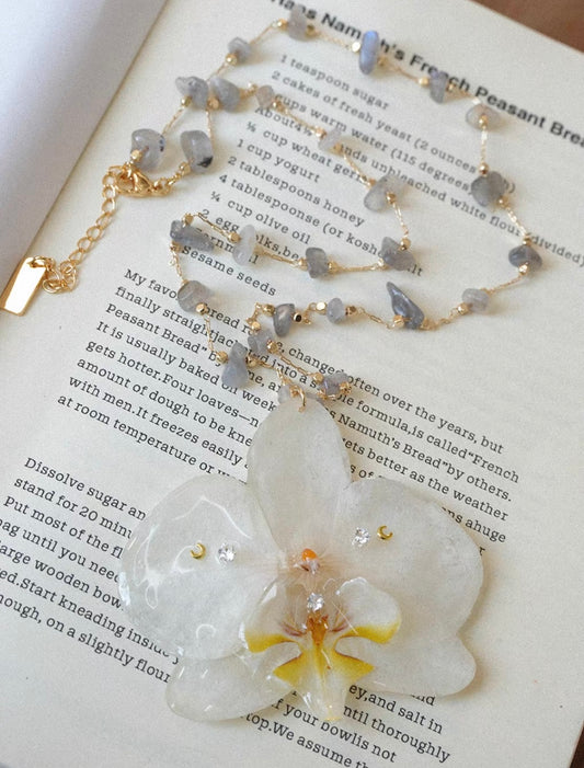 Ivory white preserved orchid pendant necklace with gold-tone chain by Terra Decode