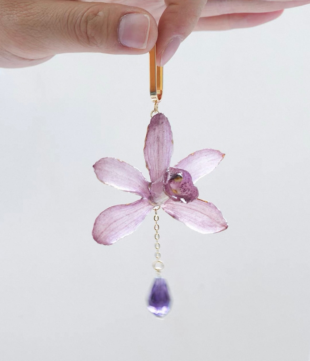 Soft purple cymbidium orchid earrings with resin petals and purple drop detail by Terra Decode