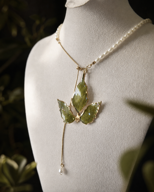 Close-up of Boston ivy leaf veins and gold-toned metal edging, Gold-Edged Boston Ivy Pearl-Drop Necklace botanical jewellery by Terra Decode