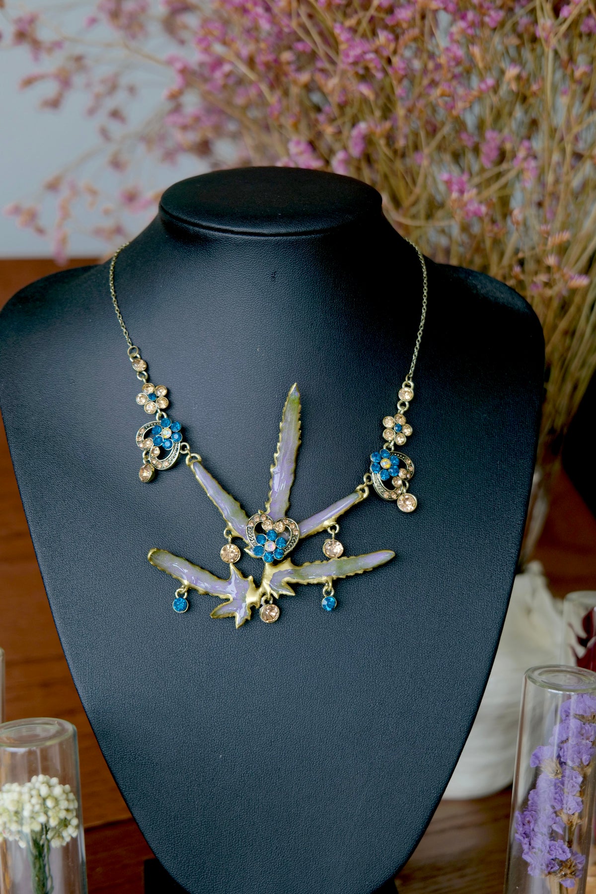 Full view of a one-of-a-kind preserved Lygodium japonicum leaf necklace by Terra Decode.