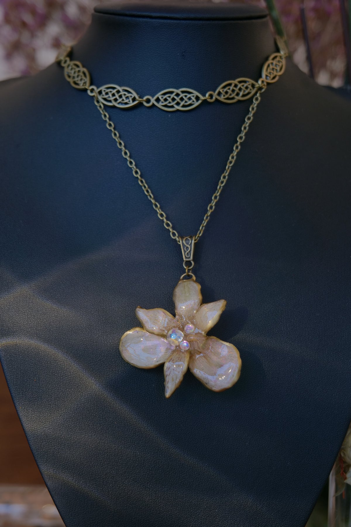 BRIGID — Celtic Peruvian Lily Iridescent Rhinestone Necklace by Terra Decode — product photograph 4 showing the handmade botanical necklace.