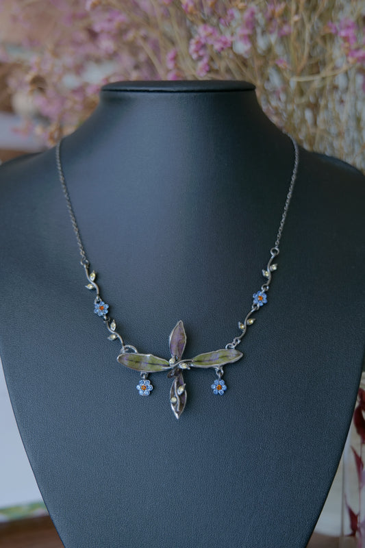 Front view of Wild Whorl necklace with preserved leaves and fine gunmetal-toned chain