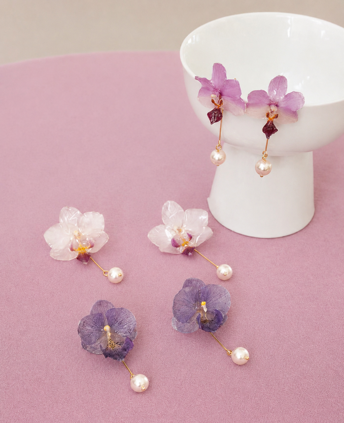 Soft pink, cream white and lavender orchid pearl drop earrings with resin petals by Terra Decode