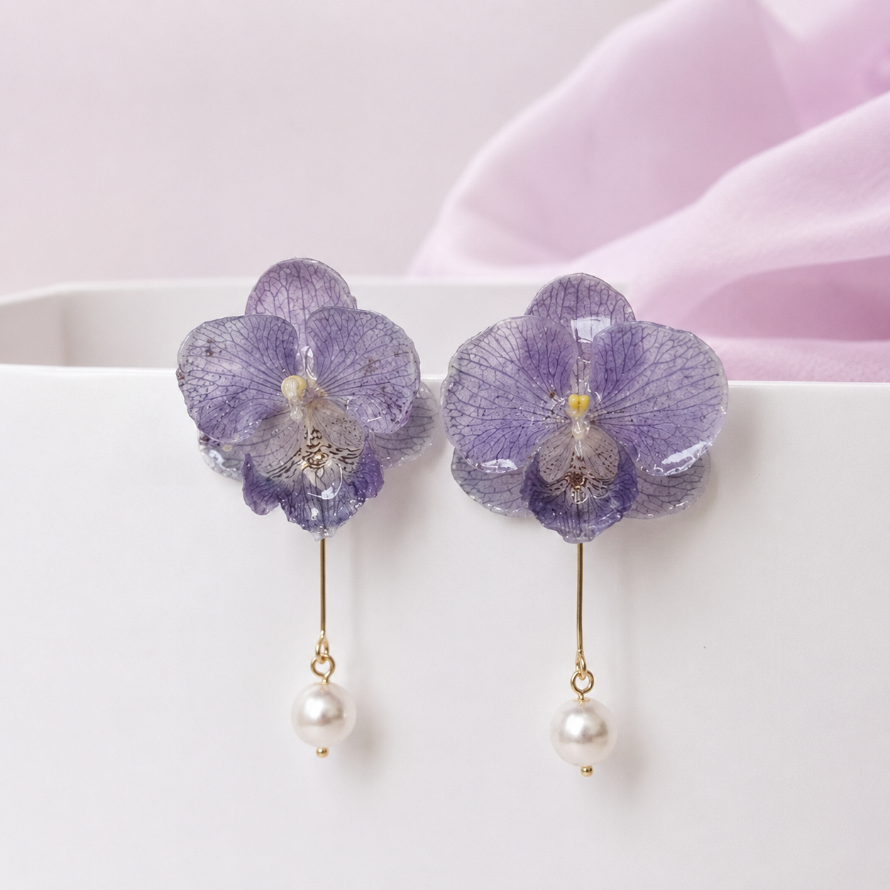 Lavender purple orchid pearl drop earrings with resin petals on printed paper by Terra Decode