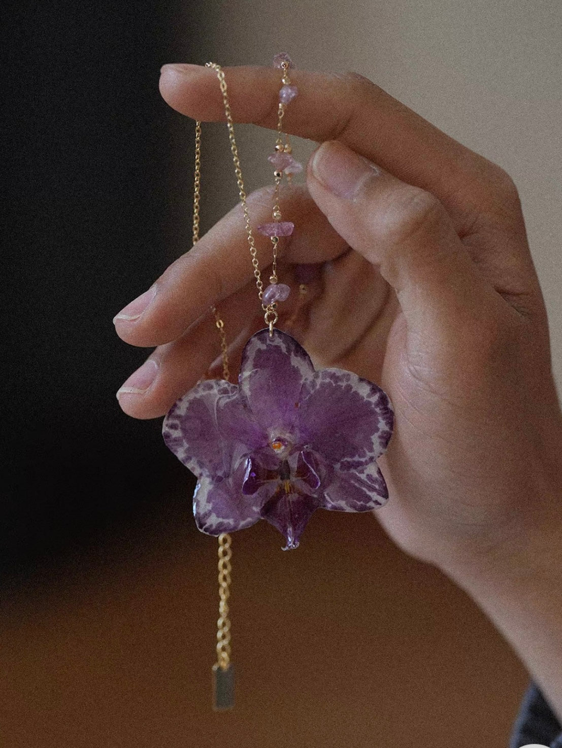 Deep purple orchid pendant necklace with resin flower and gold-tone chain by Terra Decode