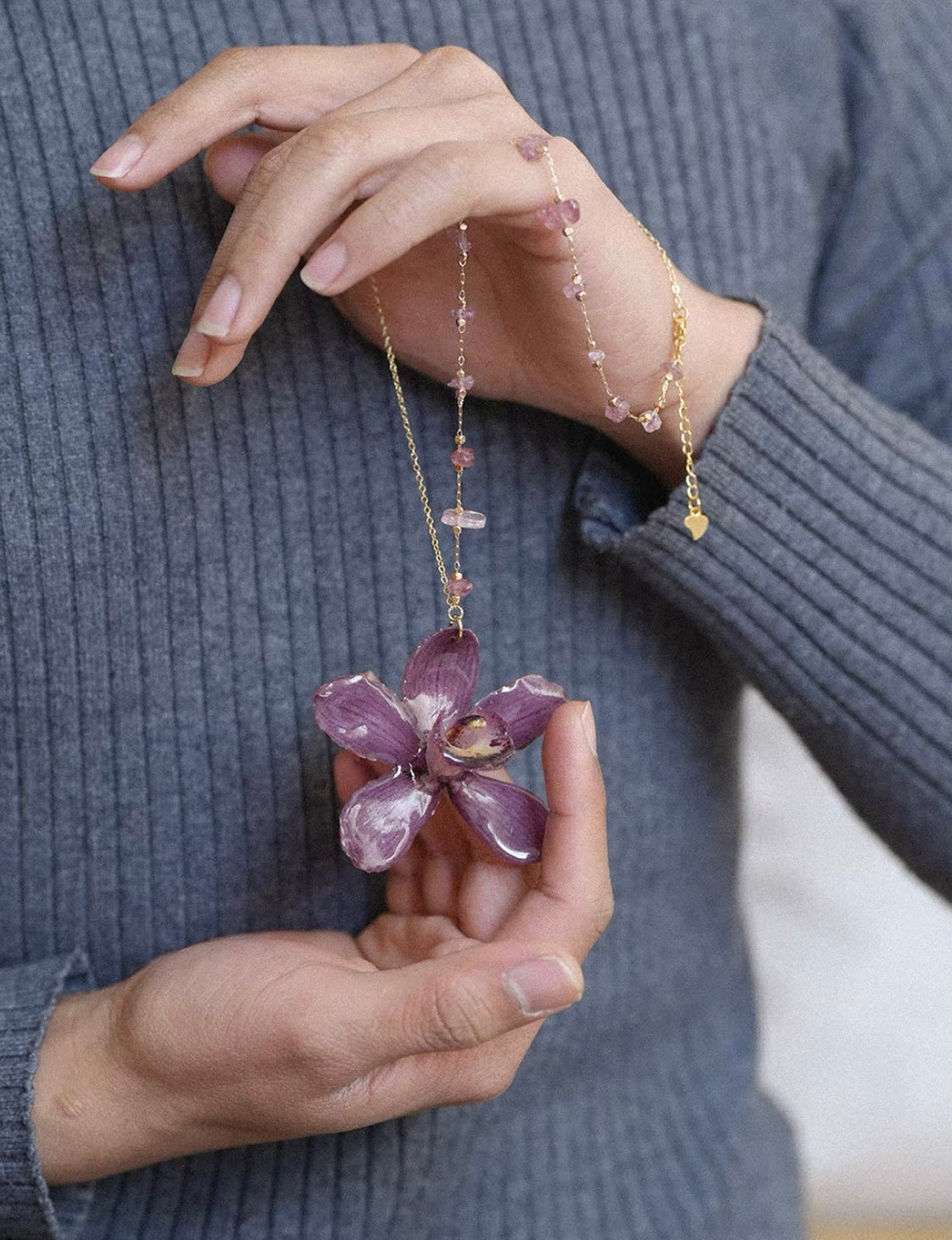 Deep plum orchid pendant necklace with resin flower petals and gold-tone beaded chain by Terra Decode