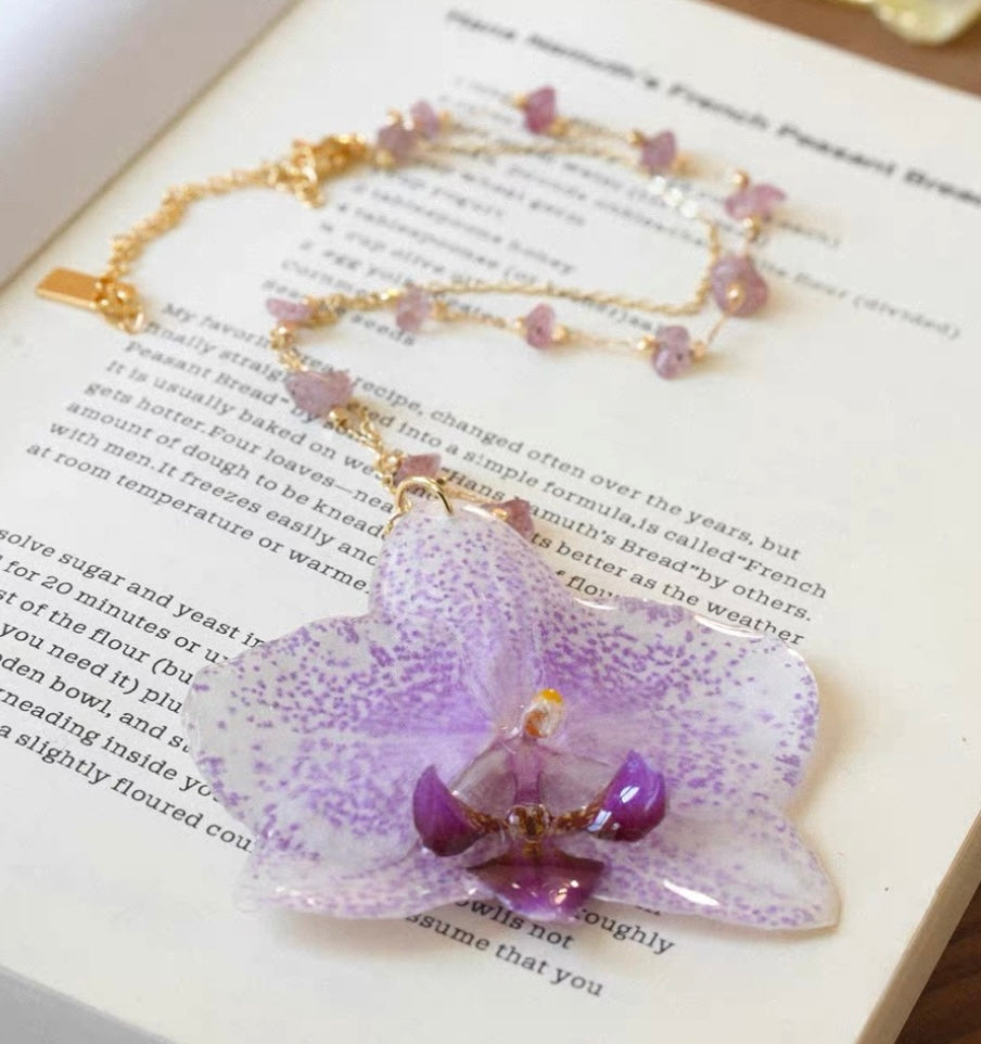 Speckled lilac orchid pendant necklace with resin flower and gold-tone beaded chain by Terra Decode