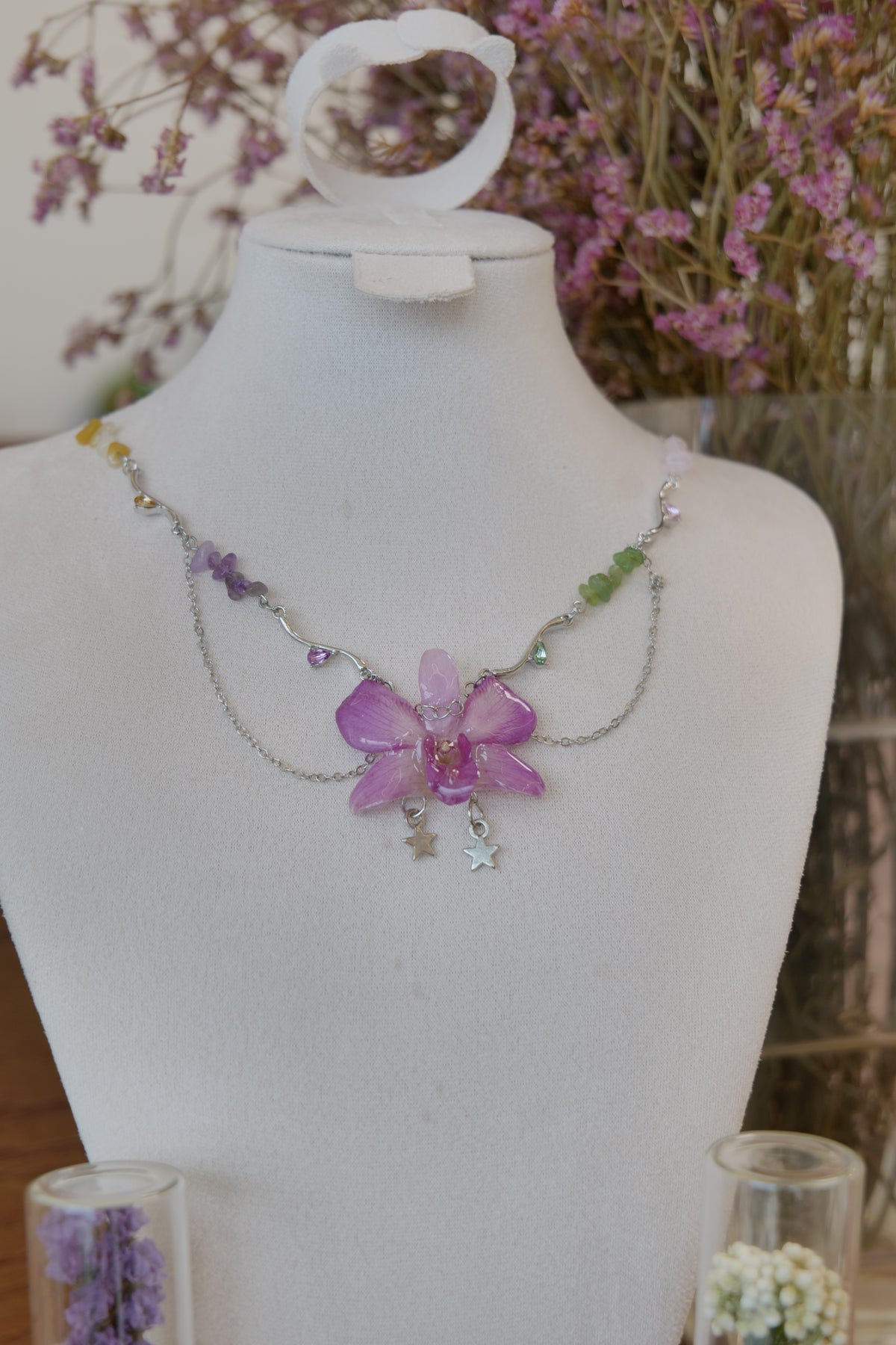 front view of purple Dendrobium orchid beaded charm necklace, handmade botanical jewellery by Terra Decode