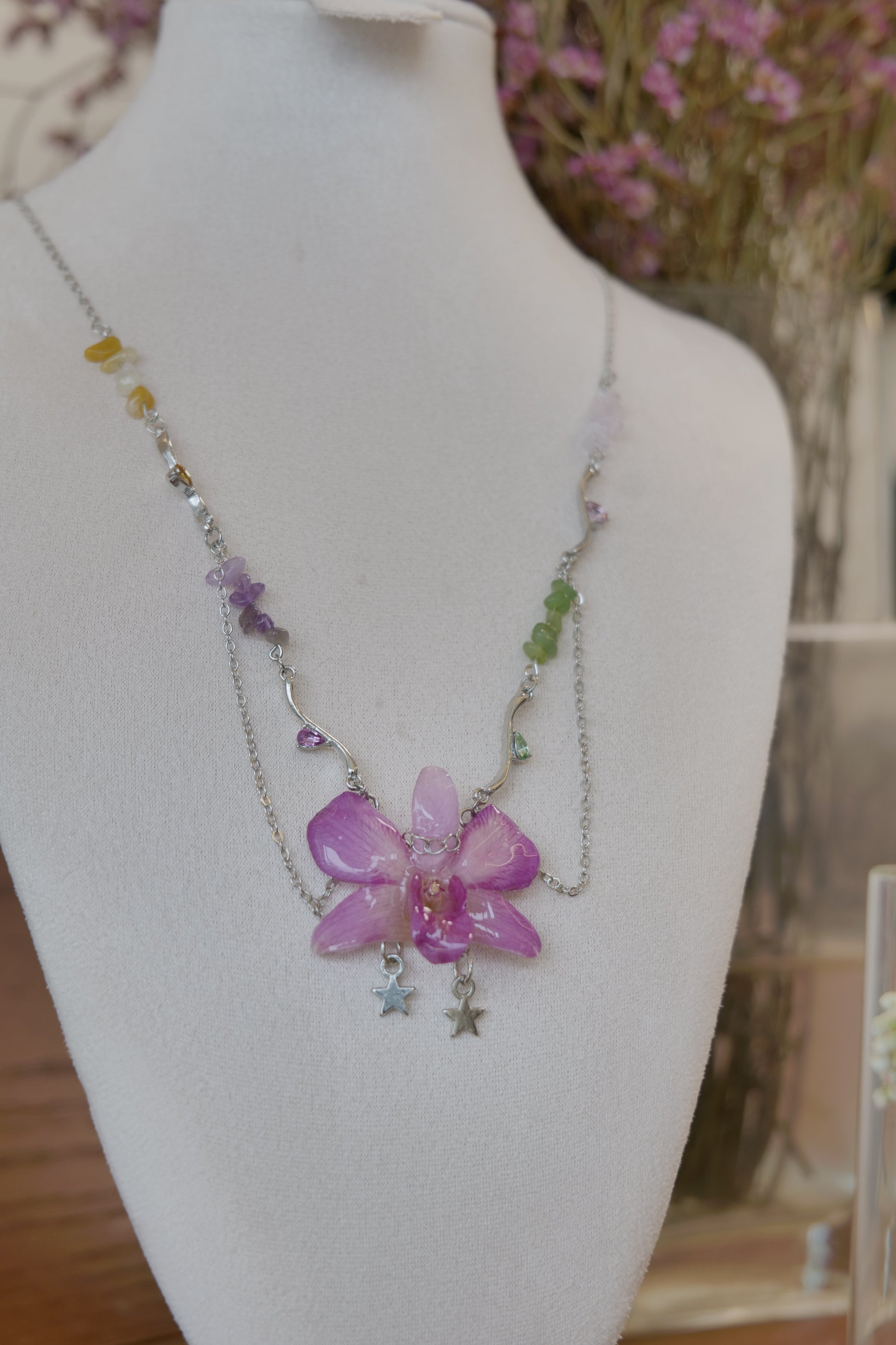 pendant detail of purple Dendrobium orchid beaded charm necklace, handmade botanical jewellery by Terra Decode