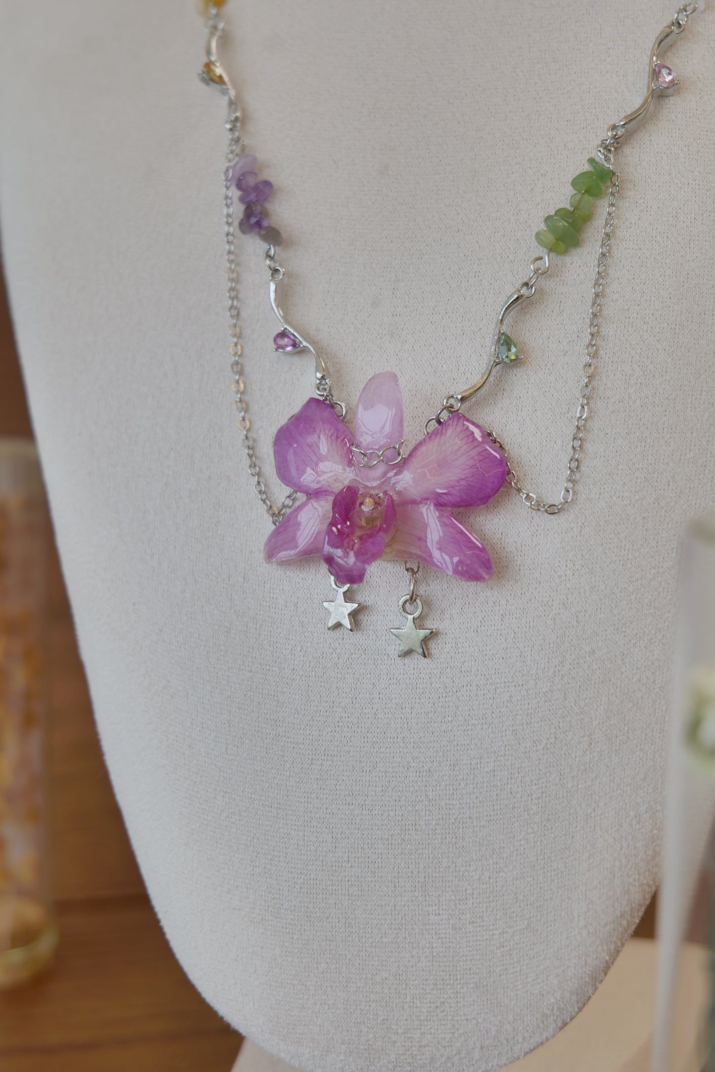 chain and charm detail of purple Dendrobium orchid beaded charm necklace, handmade botanical jewellery by Terra Decode