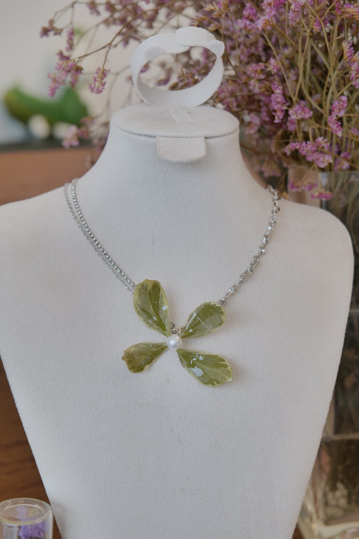 pendant detail of Golden Edge Euonymus leaf floral pendant necklace, handmade botanical jewellery by Terra Decode