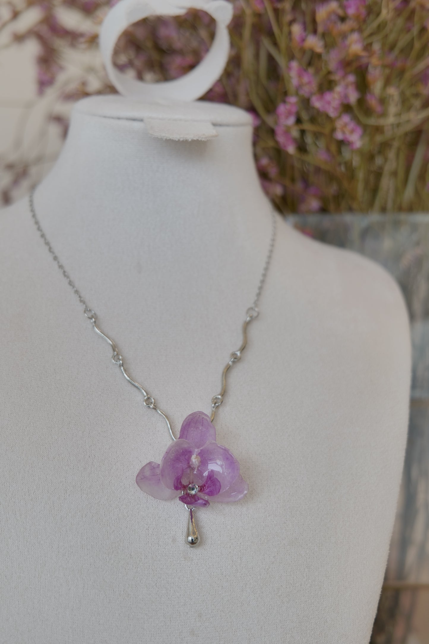 flower close-up of purple Phalaenopsis orchid charm necklace, handmade botanical jewellery by Terra Decode