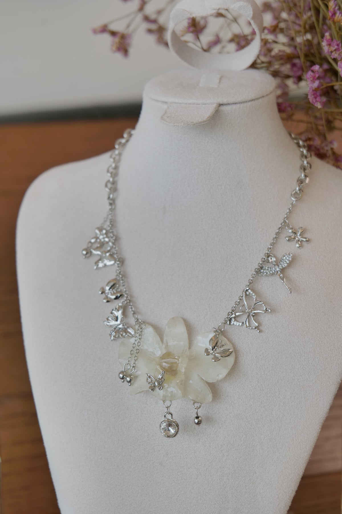 flower close-up of white Dendrobium orchid statement necklace, handmade botanical jewellery by Terra Decode
