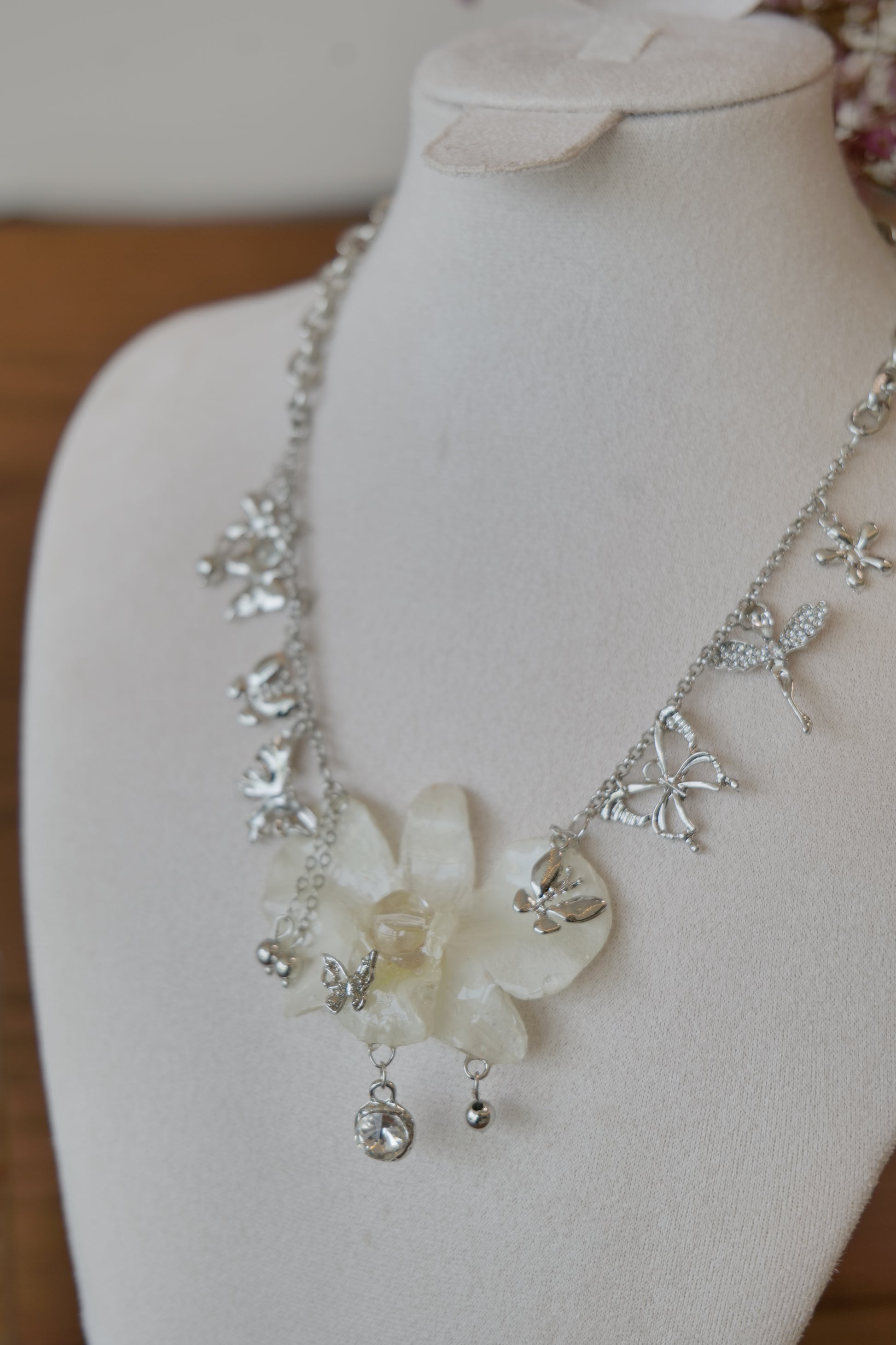 pendant detail of white Dendrobium orchid statement necklace, handmade botanical jewellery by Terra Decode