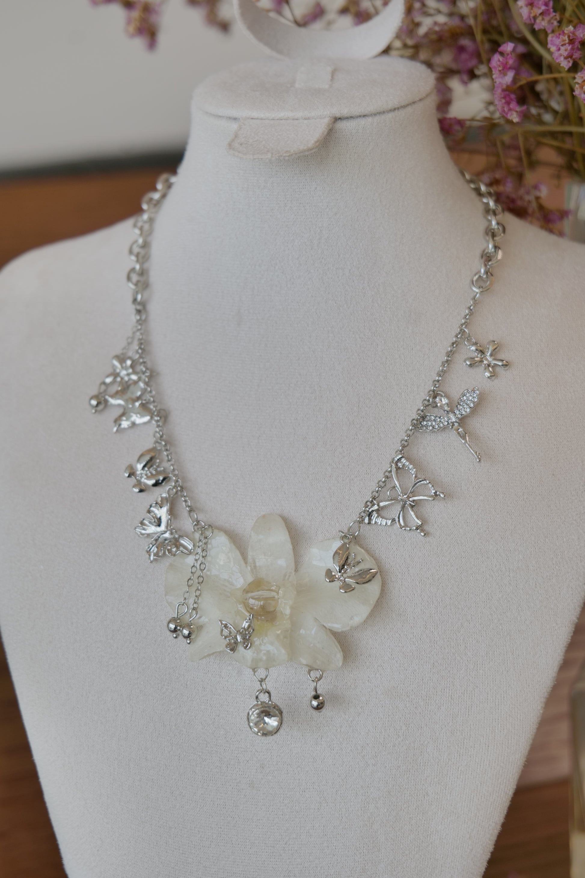 botanical detail of white Dendrobium orchid statement necklace, handmade botanical jewellery by Terra Decode