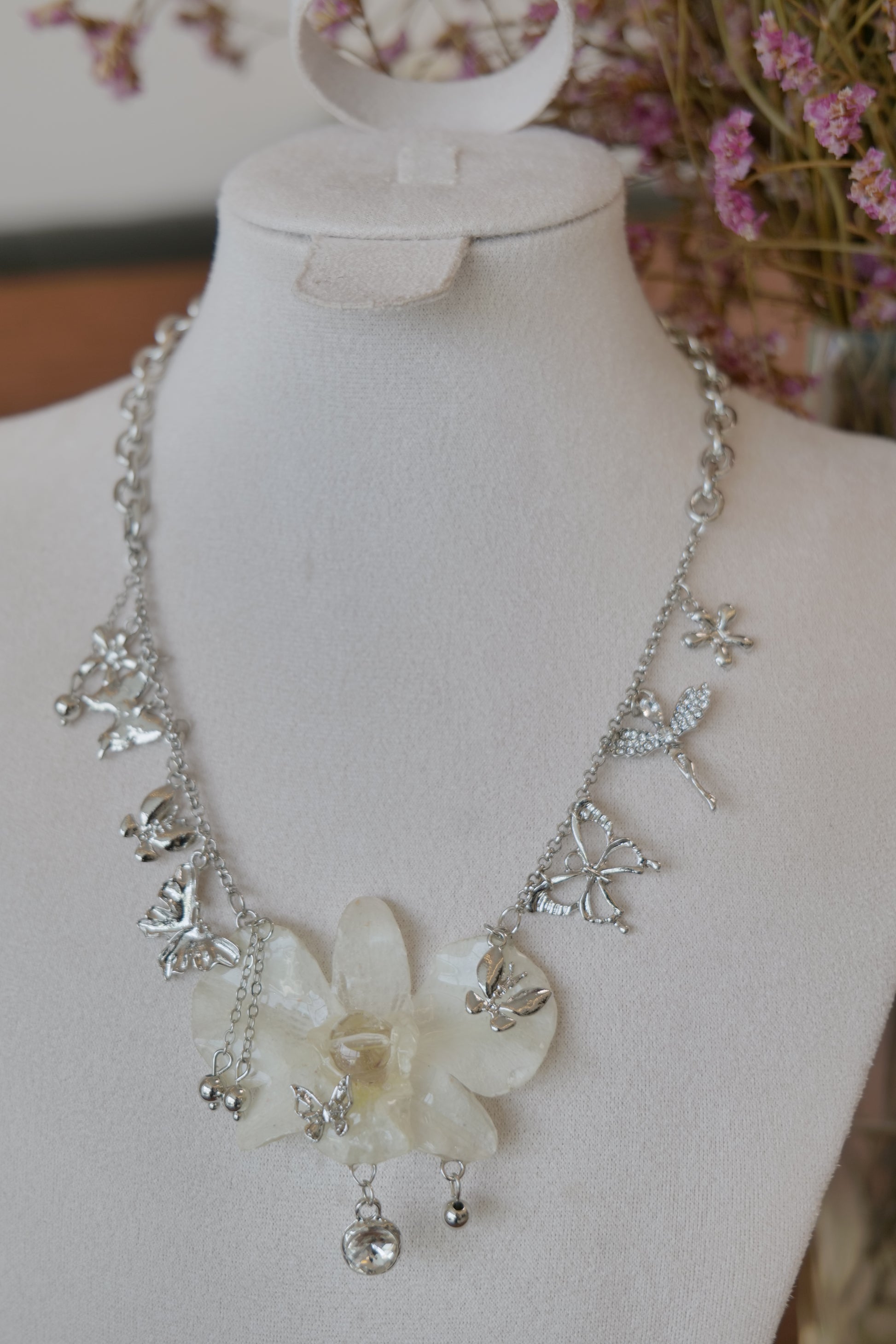 full product view of white Dendrobium orchid statement necklace, handmade botanical jewellery by Terra Decode