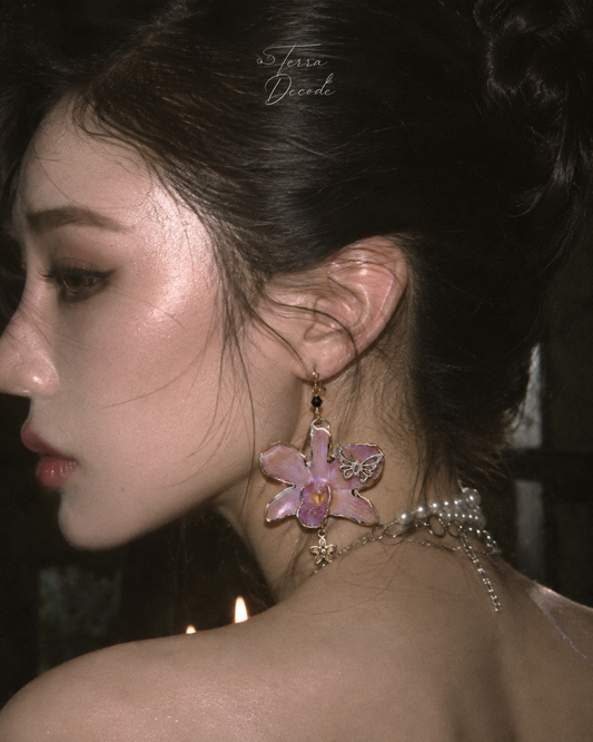 FLORELLA Purple Dendrobium Orchid Butterfly & Flower Earrings worn by a model | Terra Decode