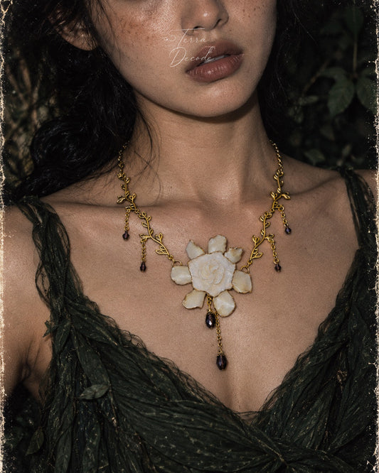 AMETHYSTA Gardenia Gold Leaf Purple Crystal Pendant Necklace worn by a model | Terra Decode