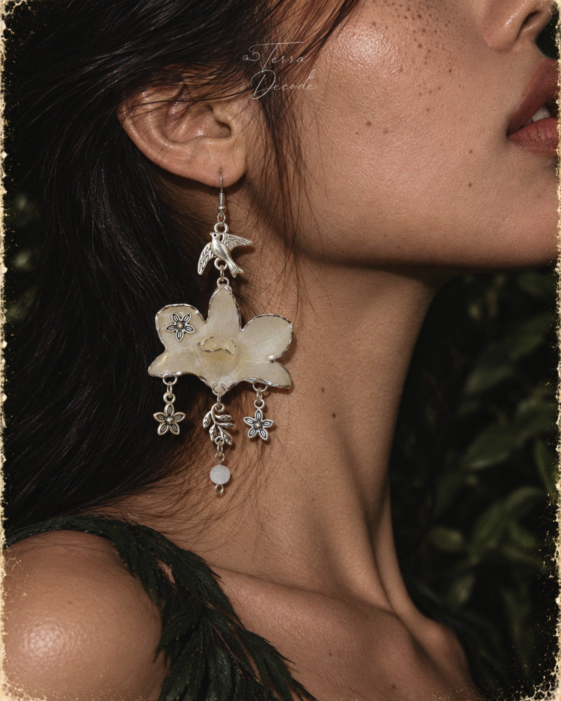 AURORA White Dendrobium Flower and Bird Dangle Earrings worn by a model | Terra Decode
