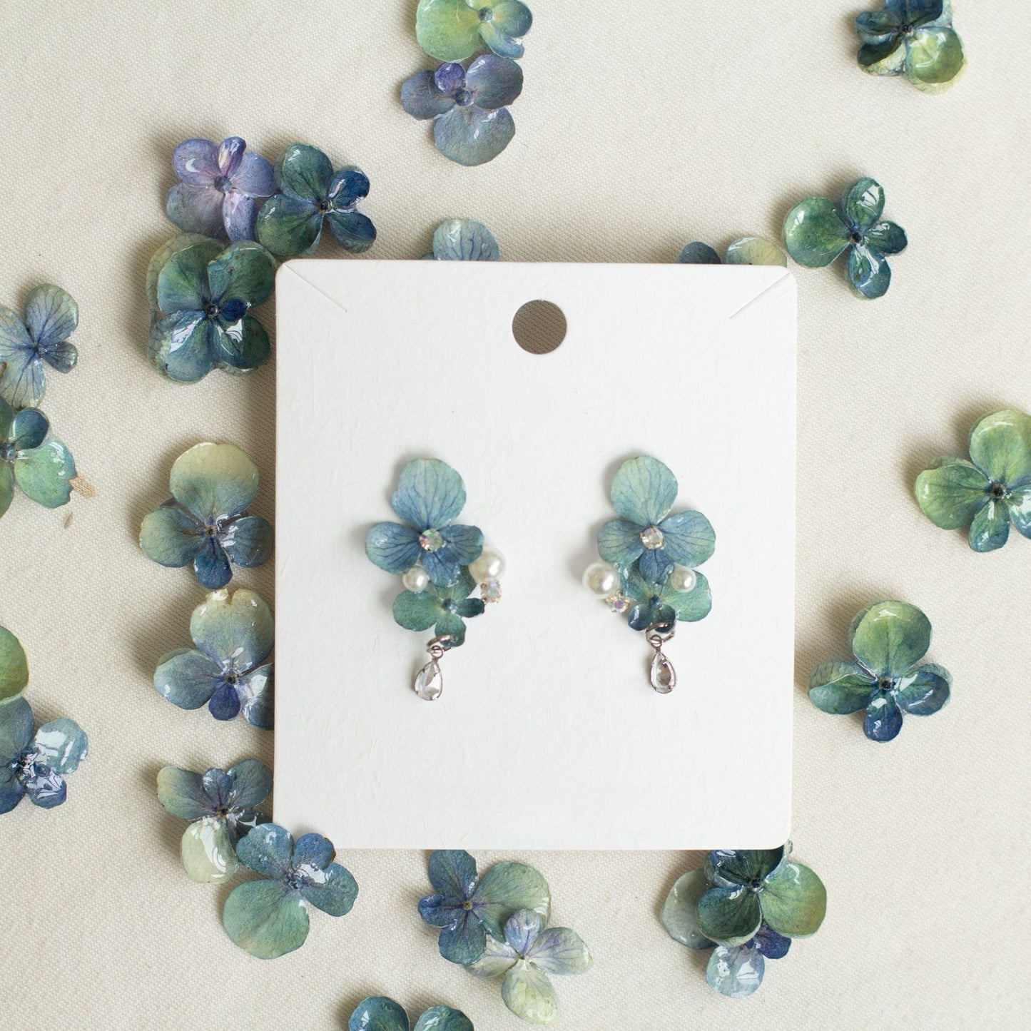 Hydrangea Blue hydrangea earrings with resin flower petals and bead details by Terra Decode