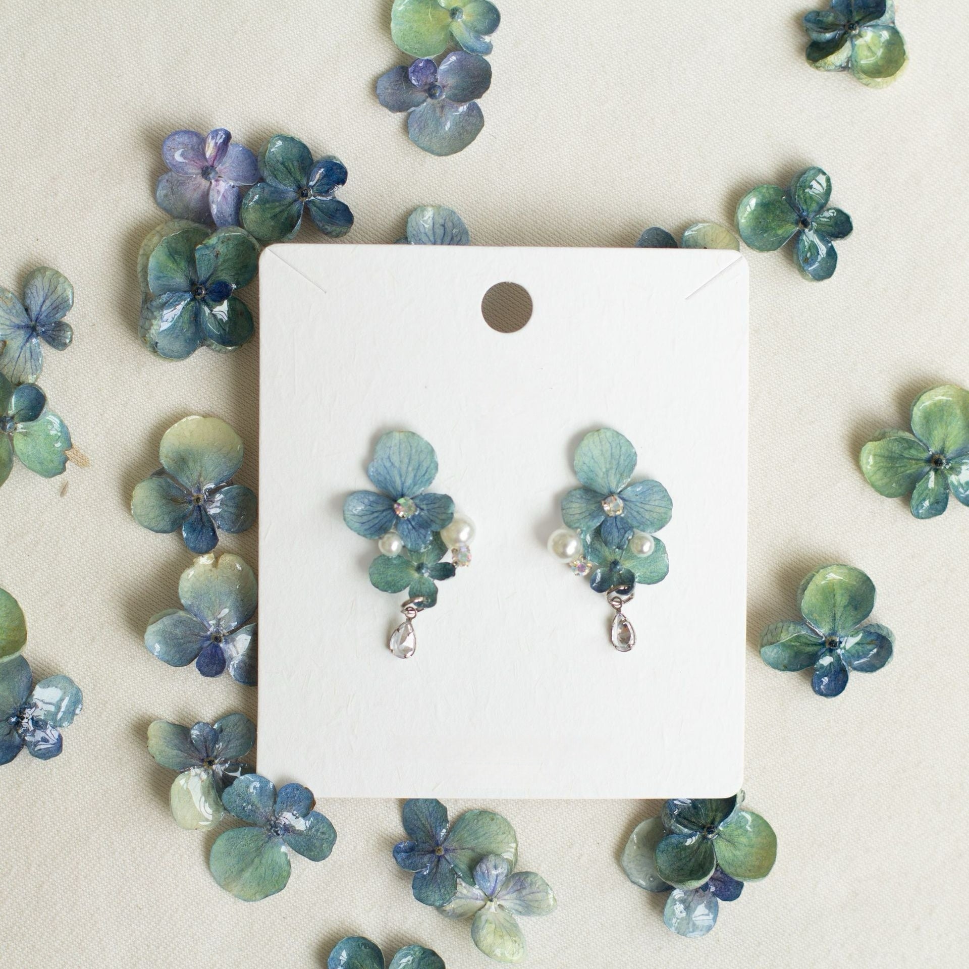 Hydrangea Blue hydrangea earrings with resin flower petals and bead details by Terra Decode