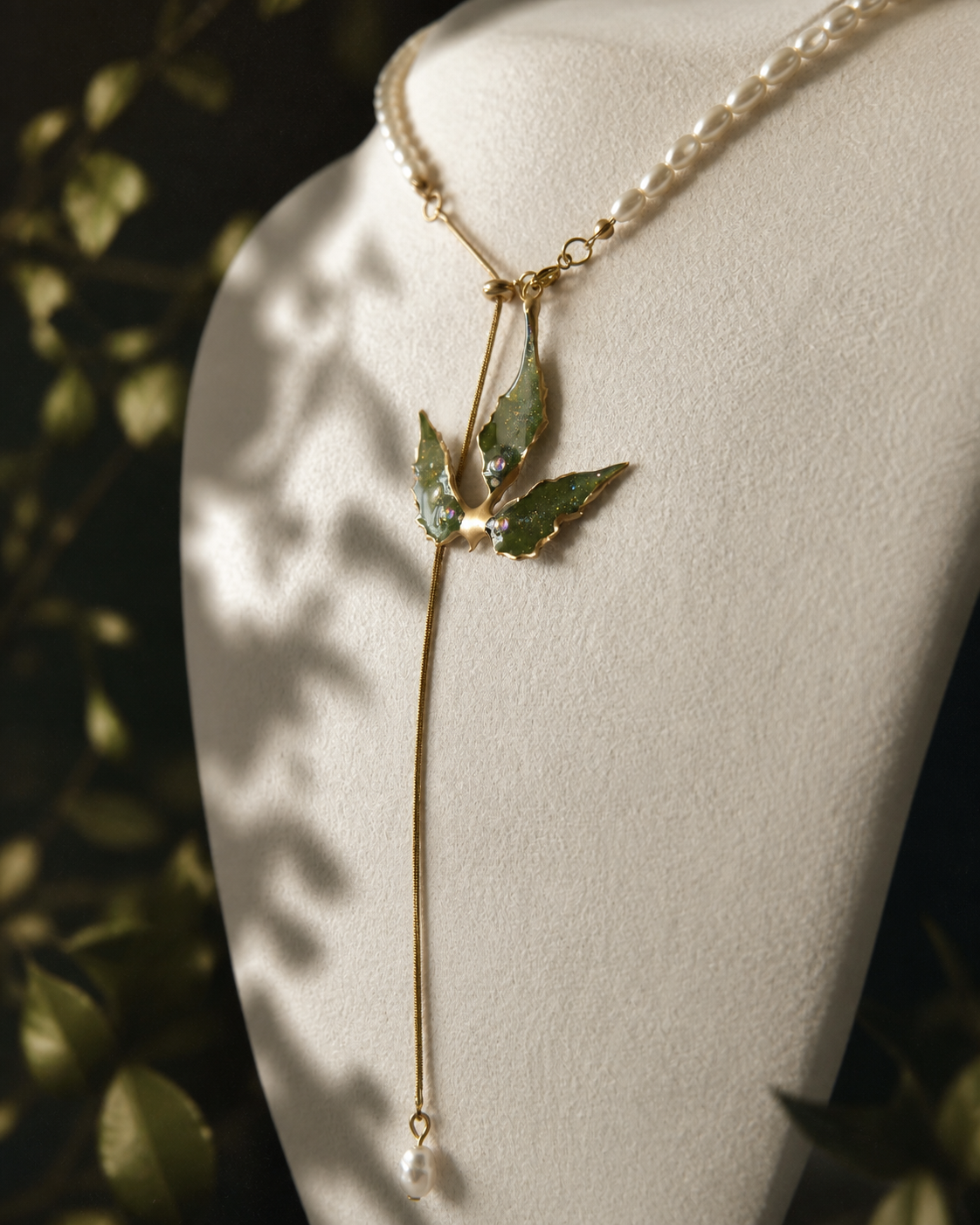 Detail of the imitation-pearl and gold-toned split-chain construction, Boston Ivy Pearl-Drop Split-Chain Necklace botanical jewellery by Terra Decode