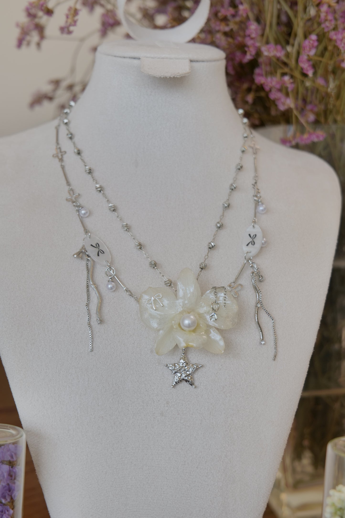 flower close-up of cream Dendrobium orchid pearl necklace, handmade botanical jewellery by Terra Decode