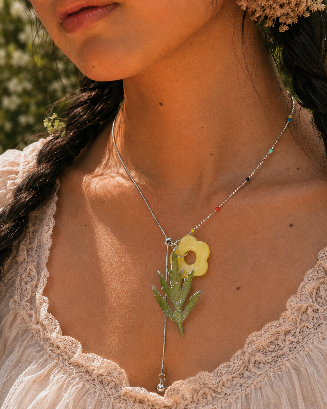 Model wearing the Chinese Mugwort Botanical Mixed-Chain Necklace by Terra Decode
