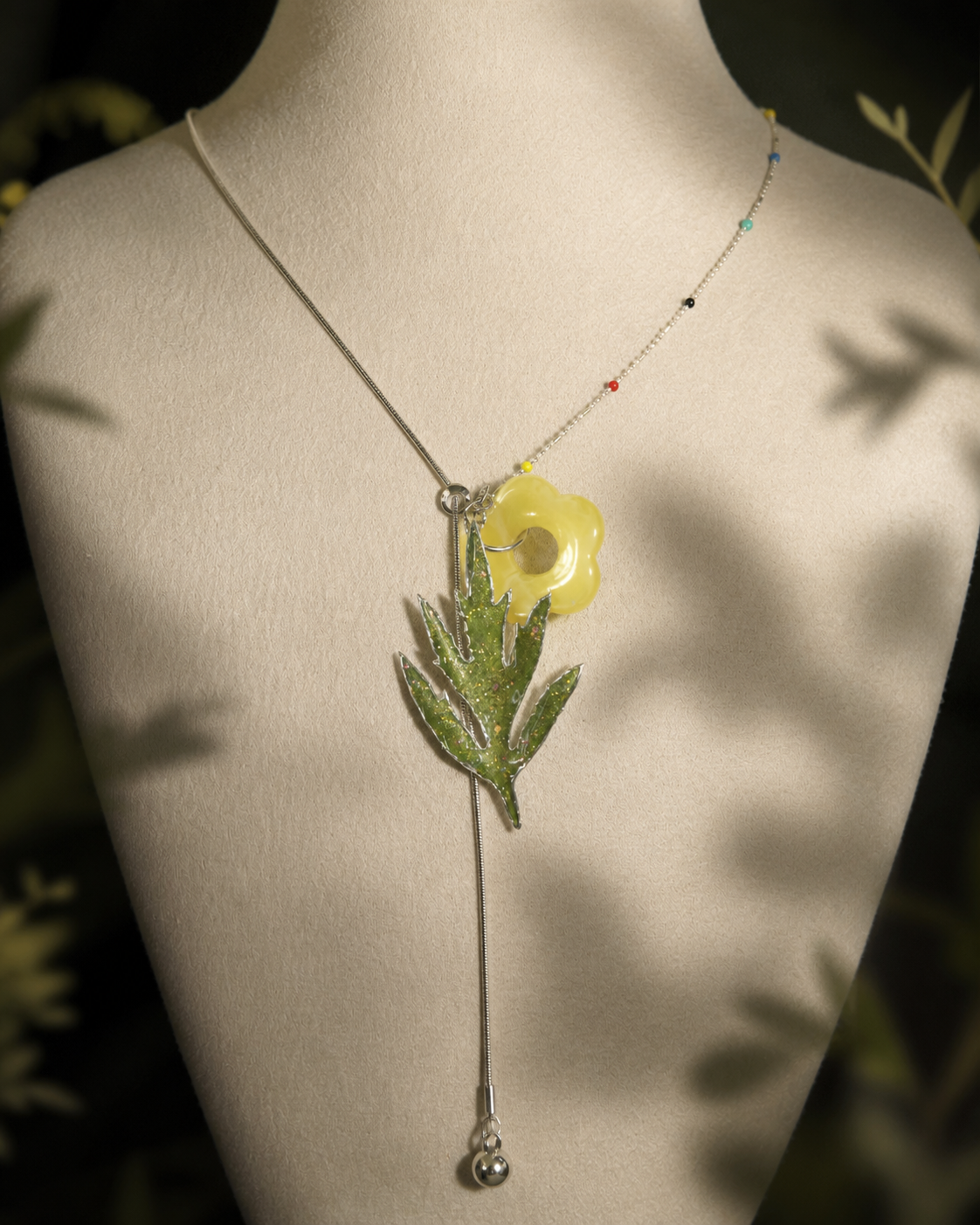 View of the real mugwort pendant, coloured beads and yellow flower charm, Chinese Mugwort Botanical Mixed-Chain Necklace botanical jewellery by Terra Decode