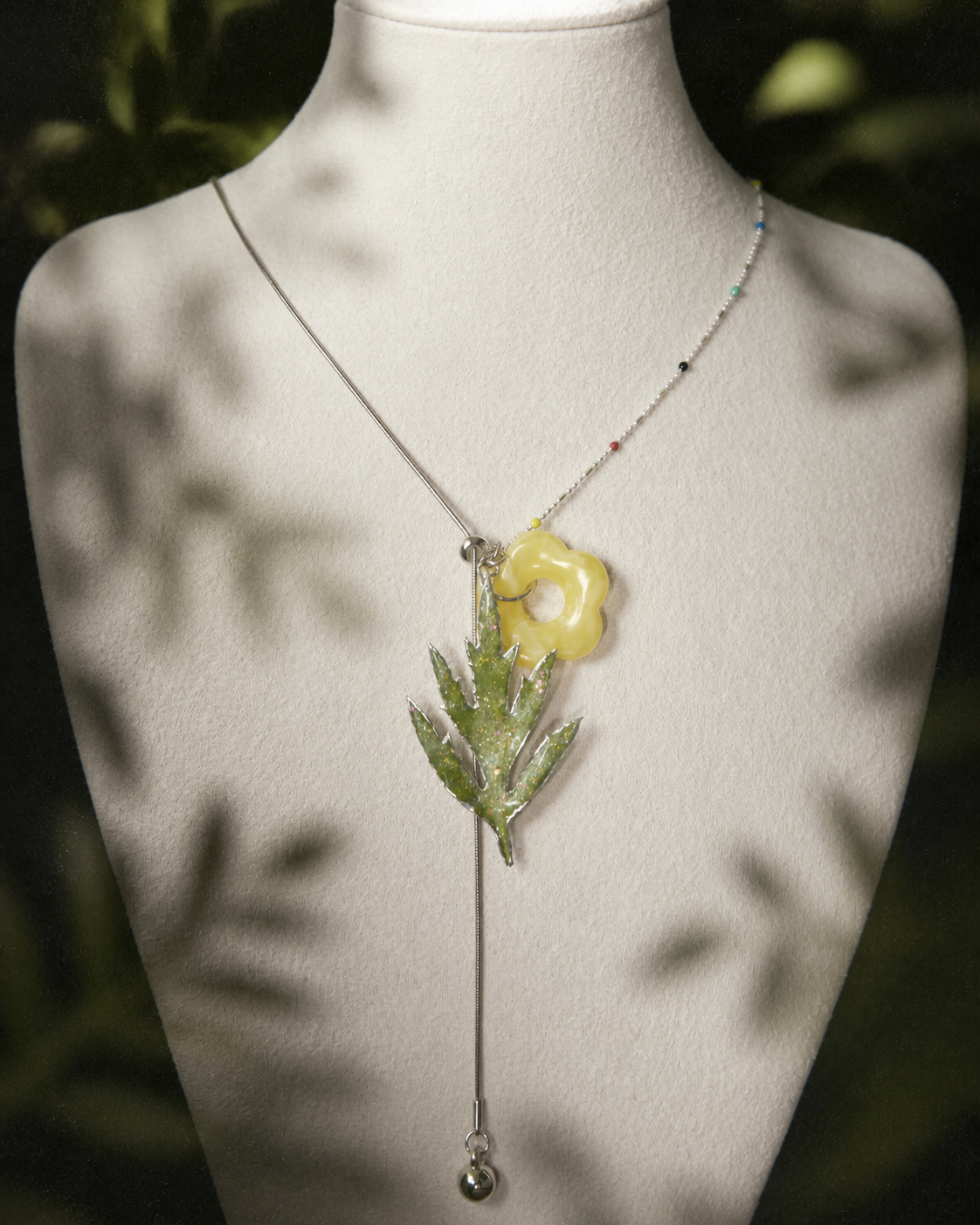 Close-up of Chinese mugwort preserved in clear resin, Chinese Mugwort Botanical Mixed-Chain Necklace botanical jewellery by Terra Decode