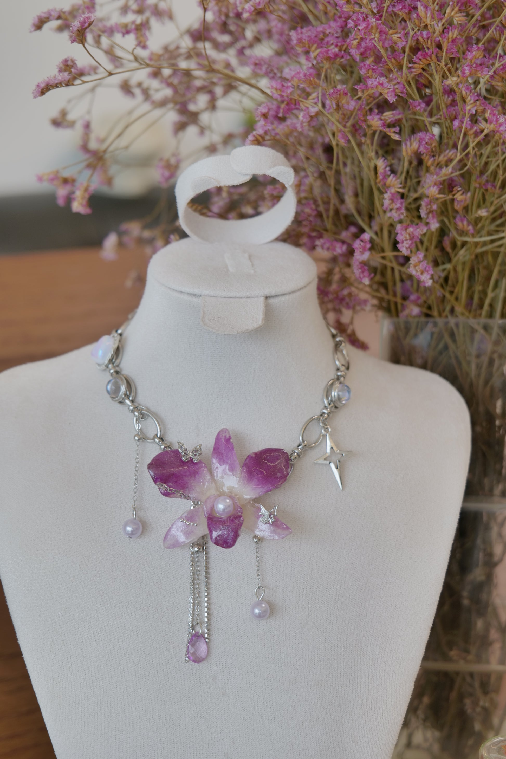 chain and charm detail of purple Dendrobium orchid pearl charm choker necklace, handmade botanical jewellery by Terra Decode