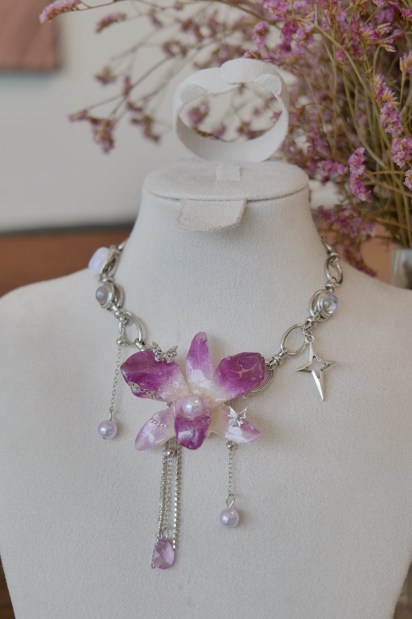 side view of purple Dendrobium orchid pearl charm choker necklace, handmade botanical jewellery by Terra Decode