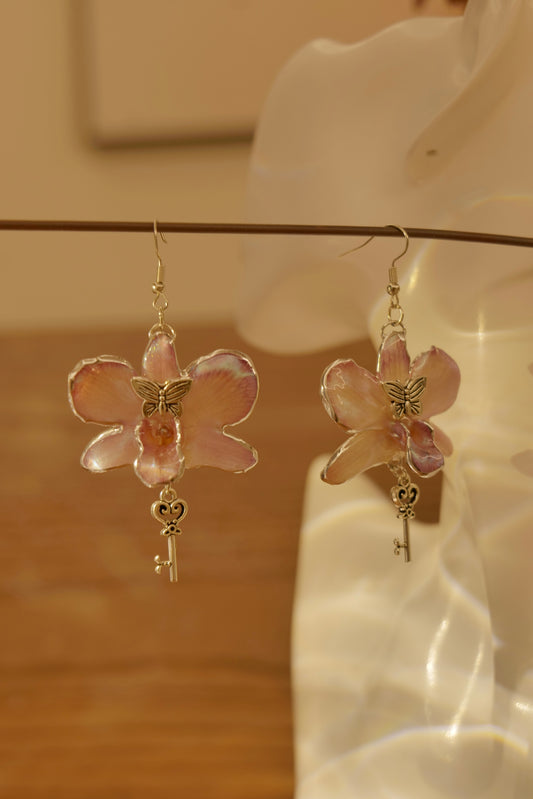 CLAVIELLE — Purple Dendrobium Orchid Key & Butterfly Earrings by Terra Decode — product photograph 1 showing the handmade botanical earrings.