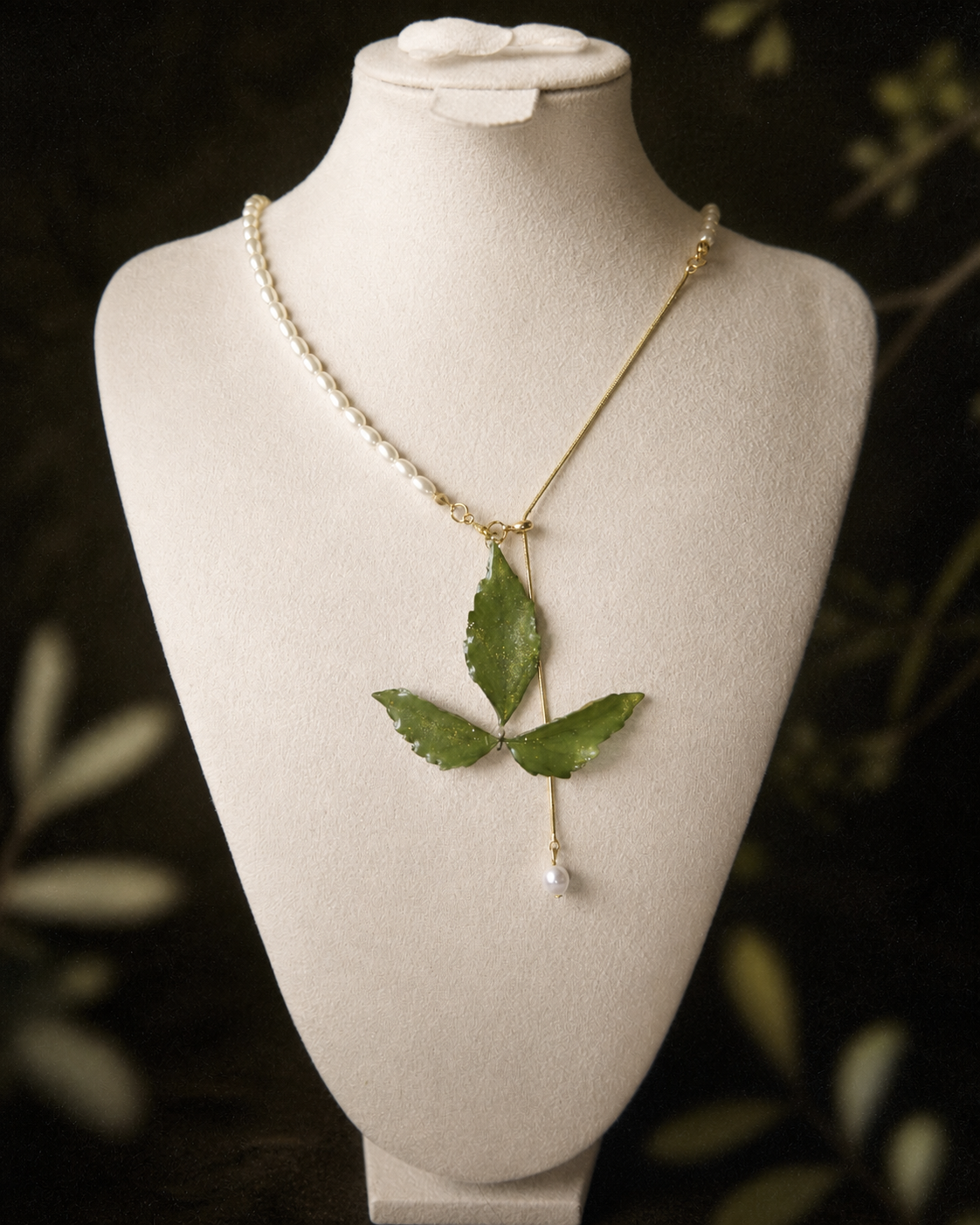 Right angled view of the botanical pendant and imitation-pearl half-chain, Clear Boston Ivy Pearl-Drop Necklace botanical jewellery by Terra Decode
