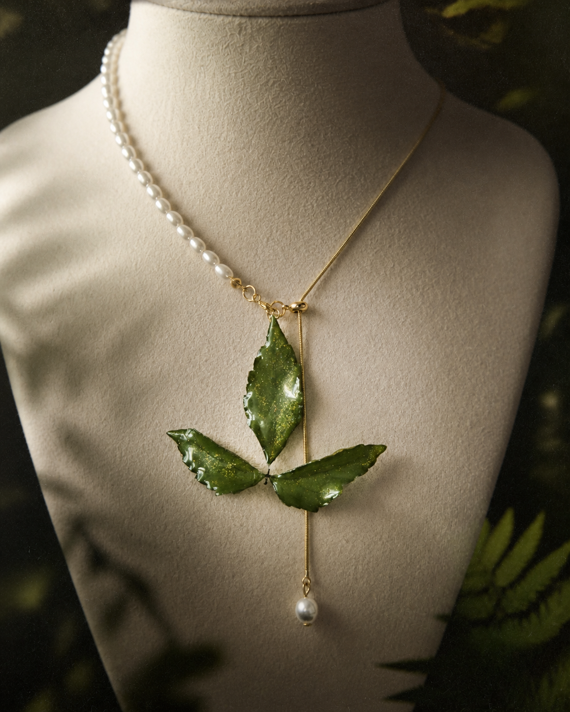 Detail of the imitation-pearl half-chain and gold-toned links, Clear Boston Ivy Pearl-Drop Necklace botanical jewellery by Terra Decode