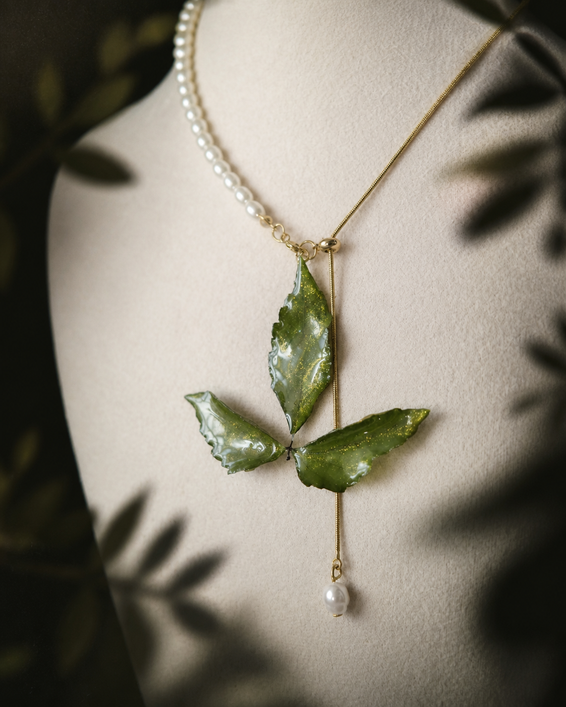 Close view of natural Boston ivy leaf veins in clear resin, Clear Boston Ivy Pearl-Drop Necklace botanical jewellery by Terra Decode