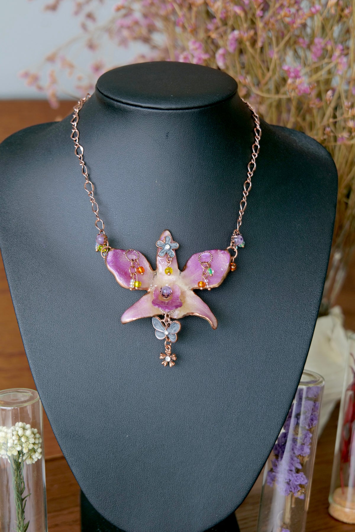 Full view of a one-of-a-kind purple Dendrobium orchid rose-gold vintage necklace by Terra Decode.