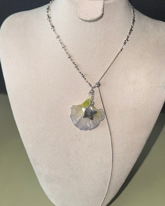 Double-lisianthus petal lariat with silver-toned star charm shown from the front