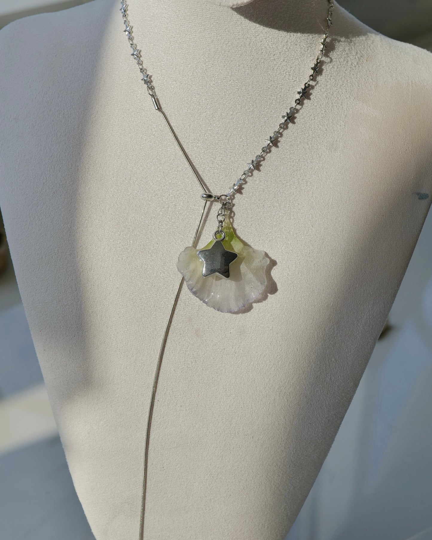 Additional front view of double-lisianthus lariat with silver-toned star charm