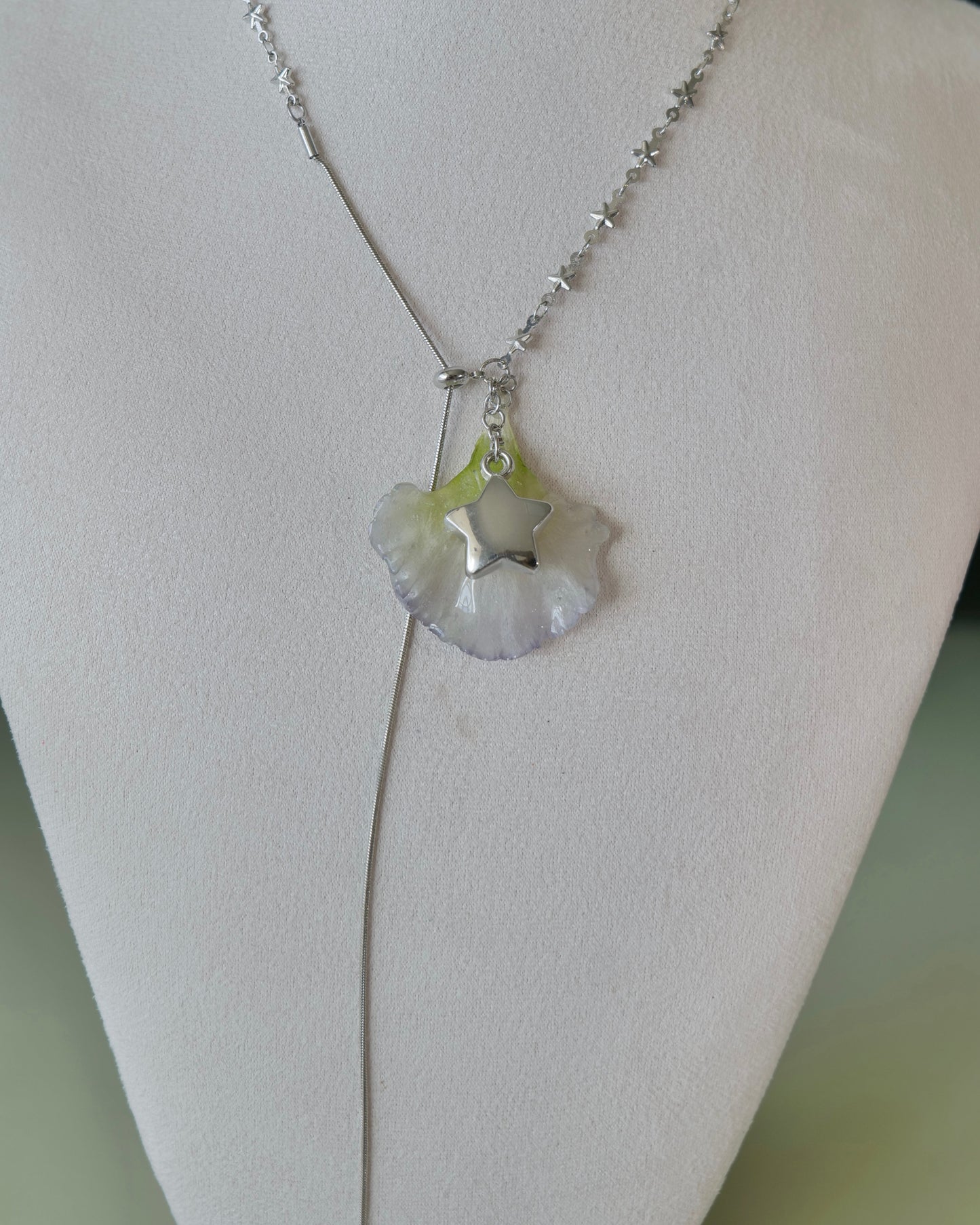 Full view of double-lisianthus necklace showing the long chain tail