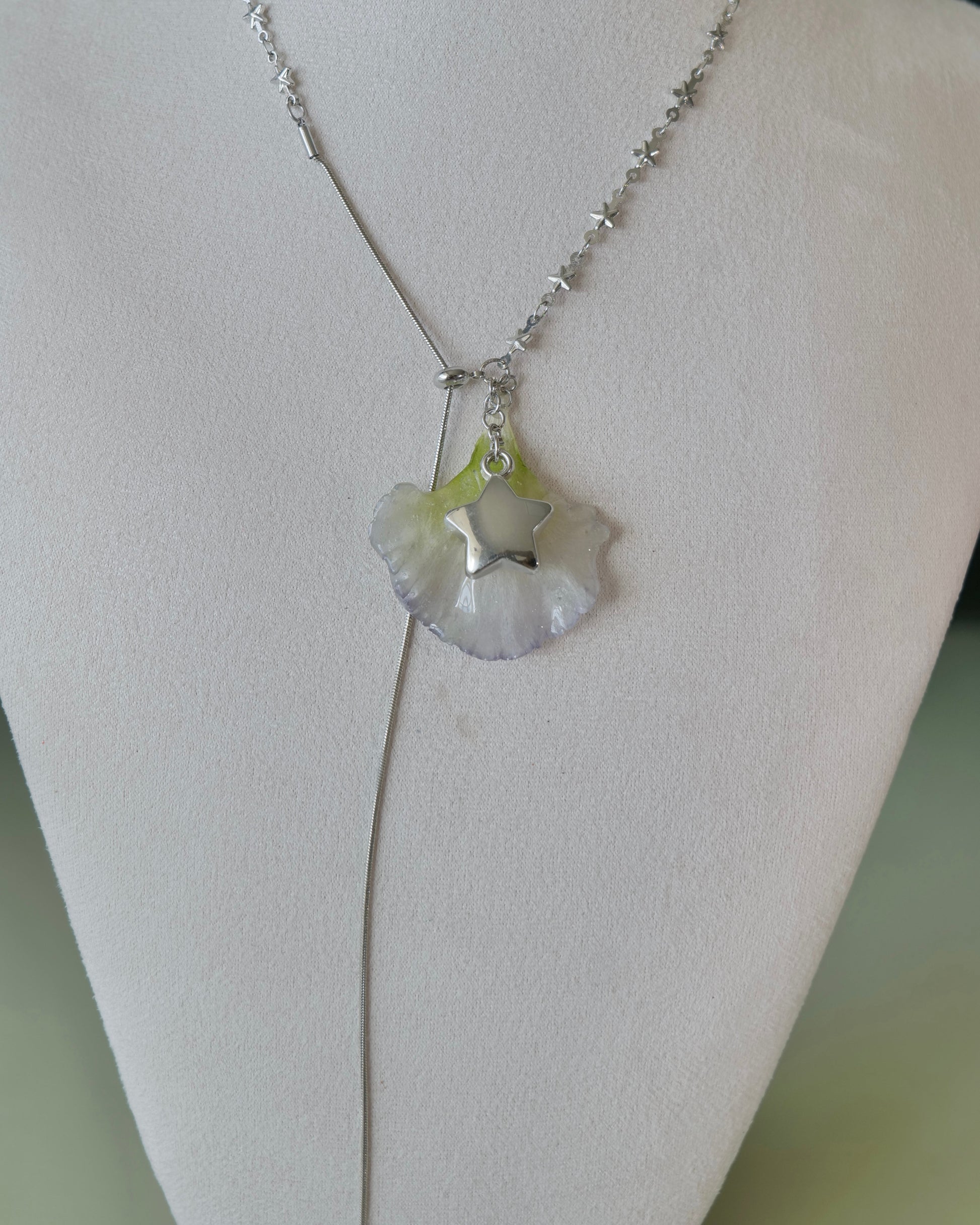 Full view of double-lisianthus necklace showing the long chain tail