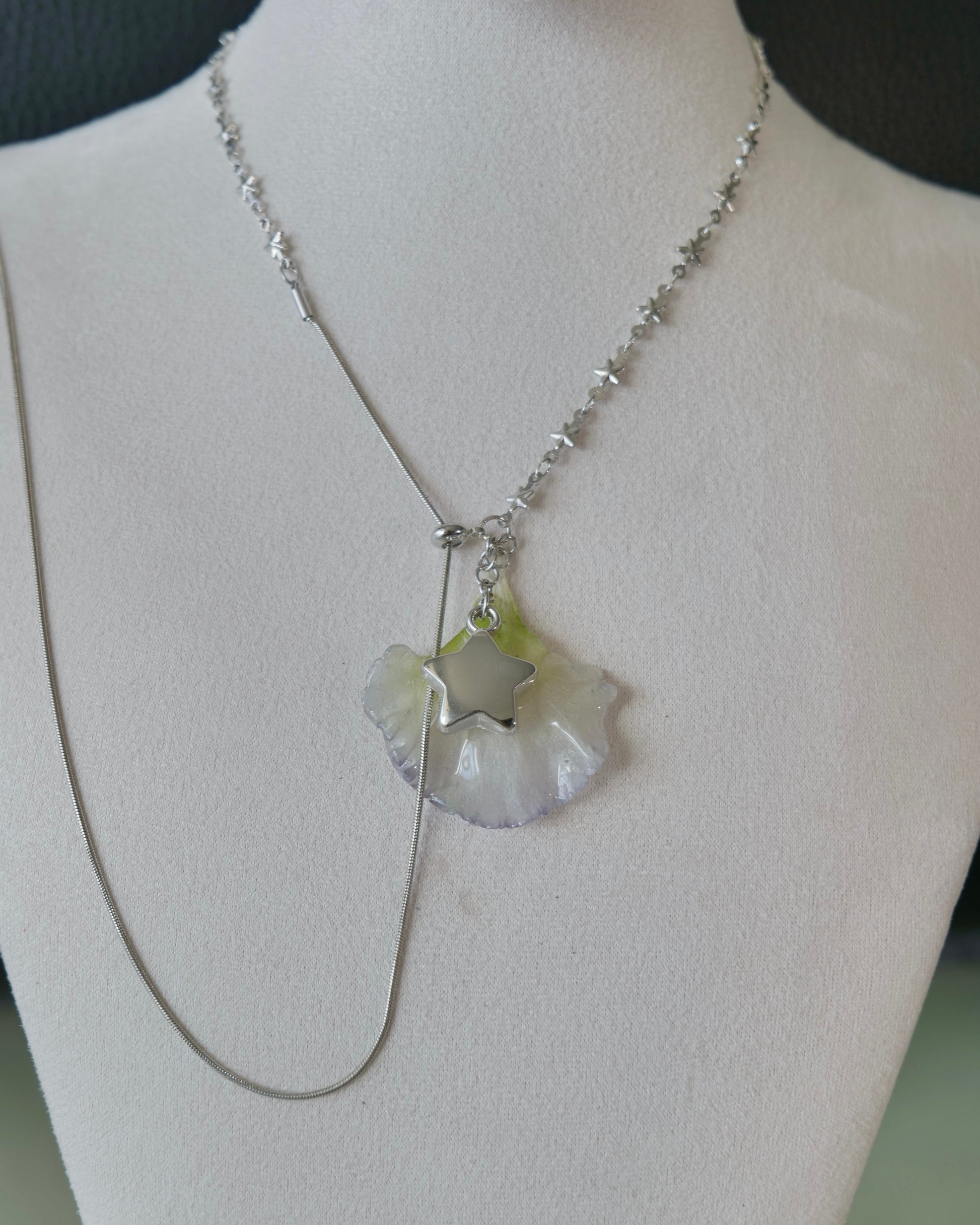 Natural-light front view of pale double-lisianthus petal necklace