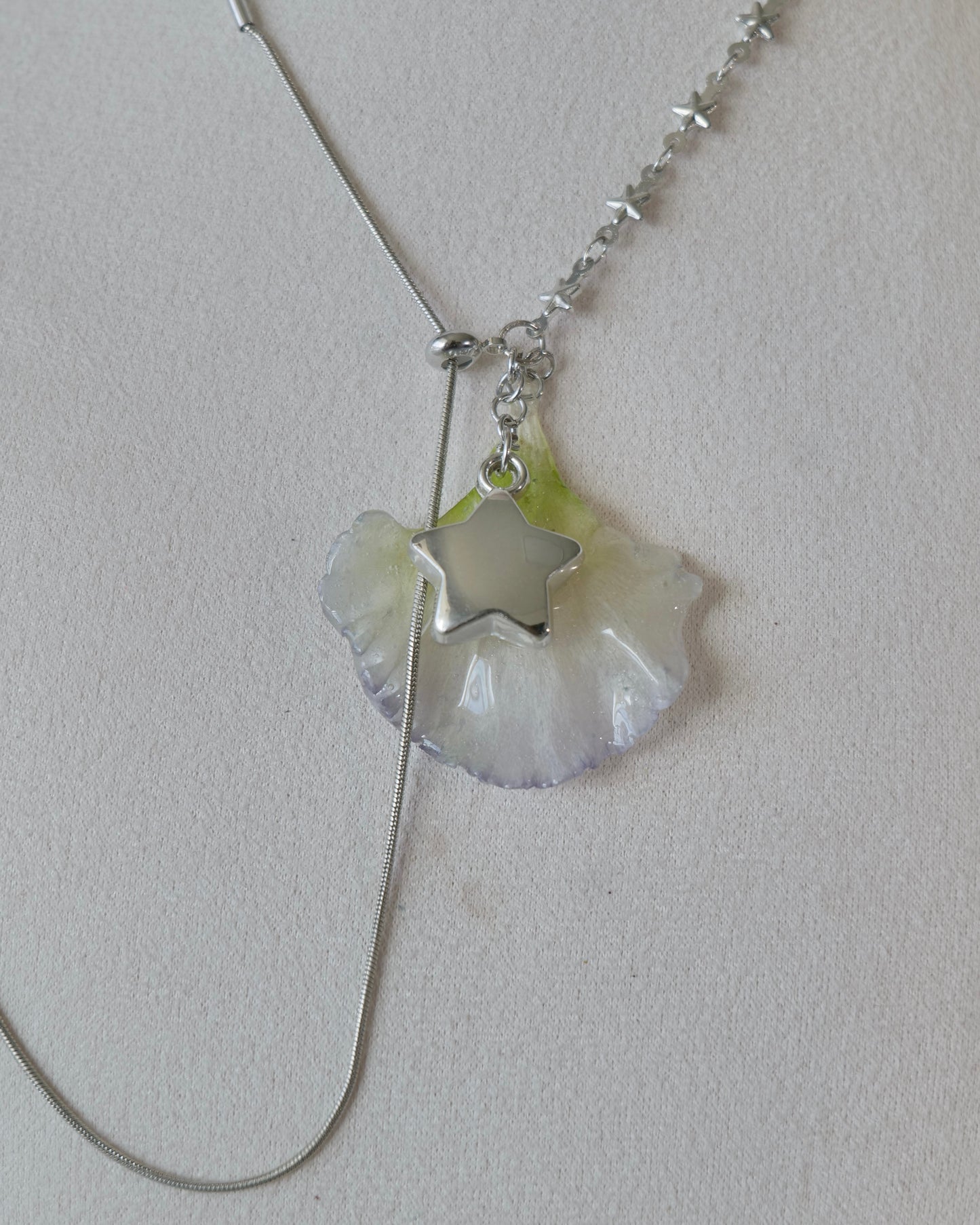 Detailed angle of lisianthus resin pendant and sliding lariat construction
