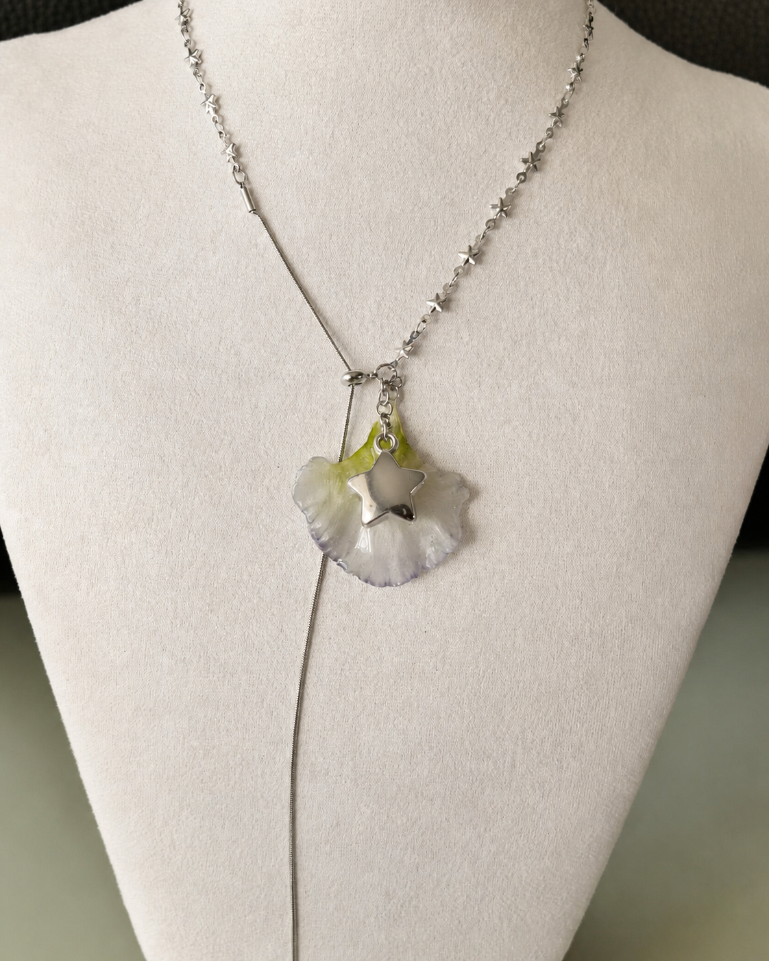 Front display view of the Double Lisianthus Star Adjustable Lariat Necklace with preserved translucent petal, Double Lisianthus Star Adjustable Lariat Necklace botanical jewellery by Terra Decode
