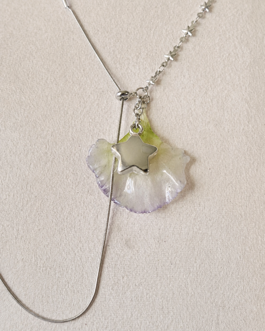 Pendant detail showing the real lisianthus petal preserved in clear resin, Double Lisianthus Star Adjustable Lariat Necklace botanical jewellery by Terra Decode