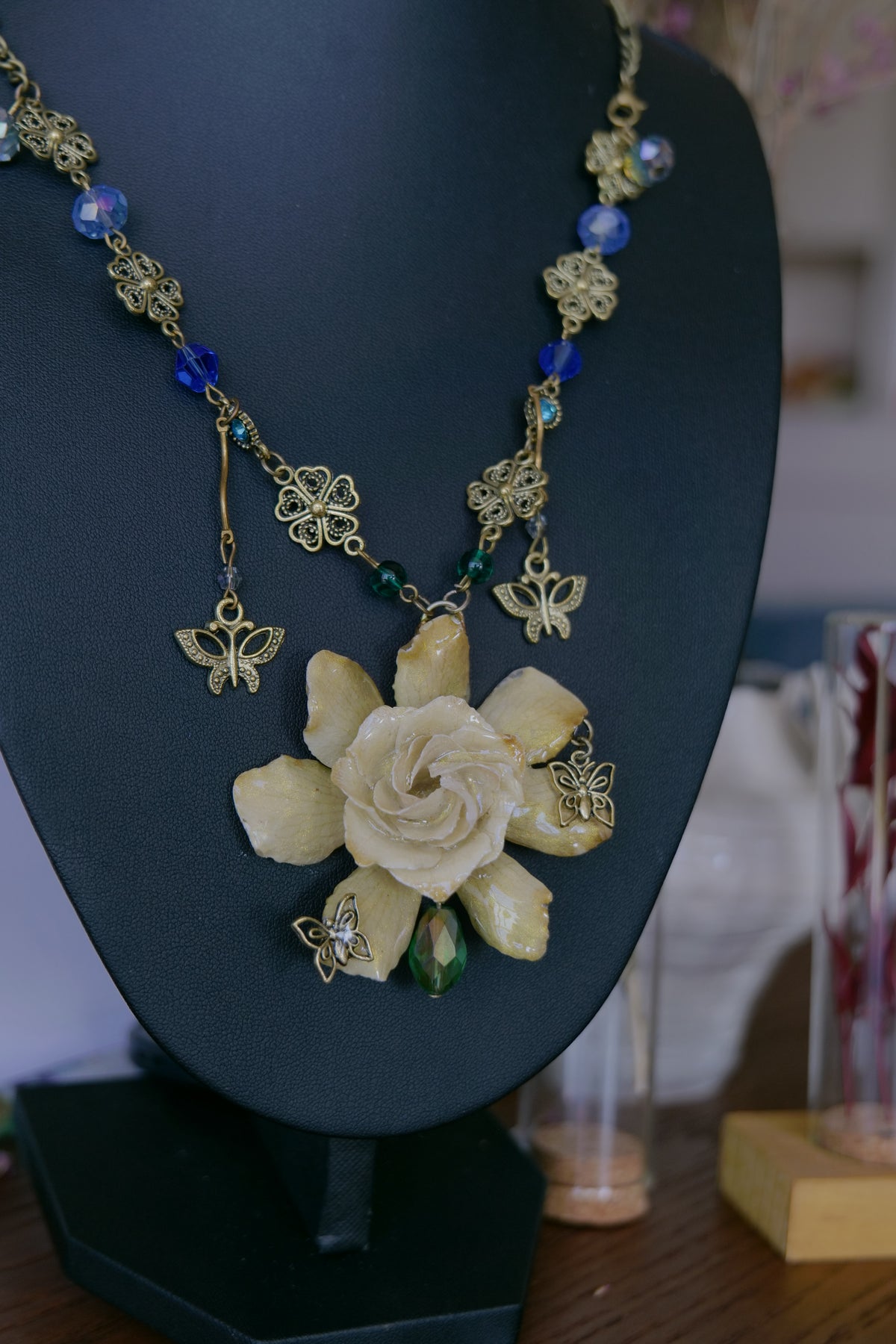 Back and fastening detail of the handmade gardenia botanical necklace