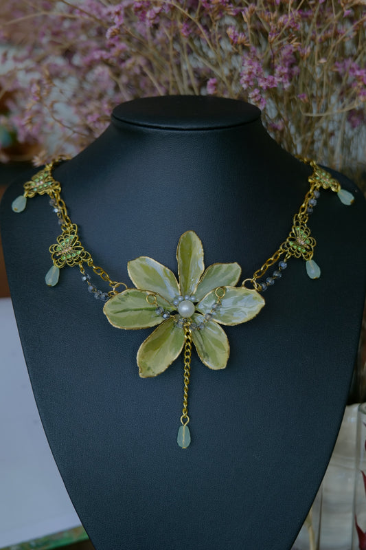 Front view of preserved golden-edge Euonymus necklace with gold-toned double chain