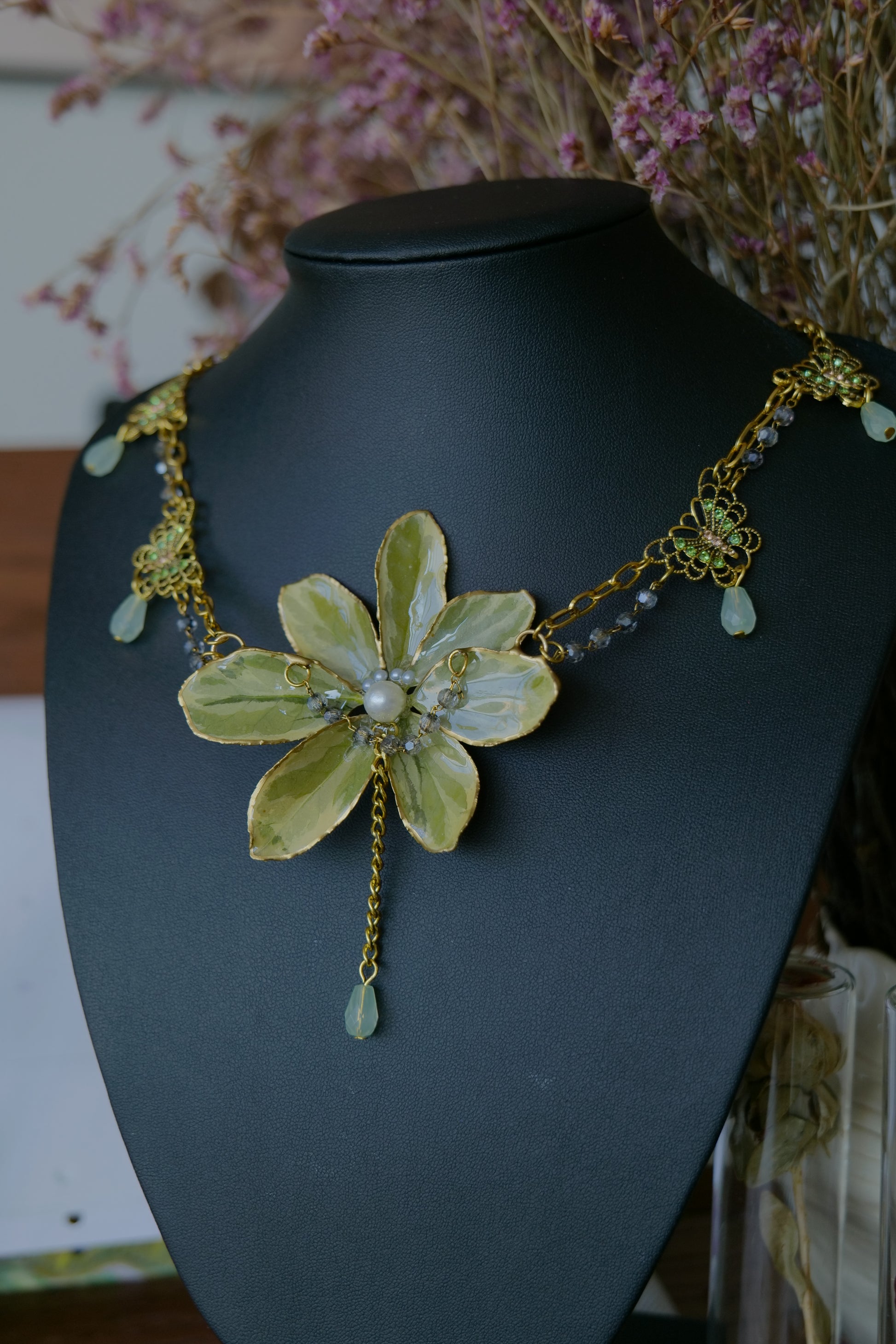 Gold-toned double-chain and floral filigree details on the Euonymus necklace