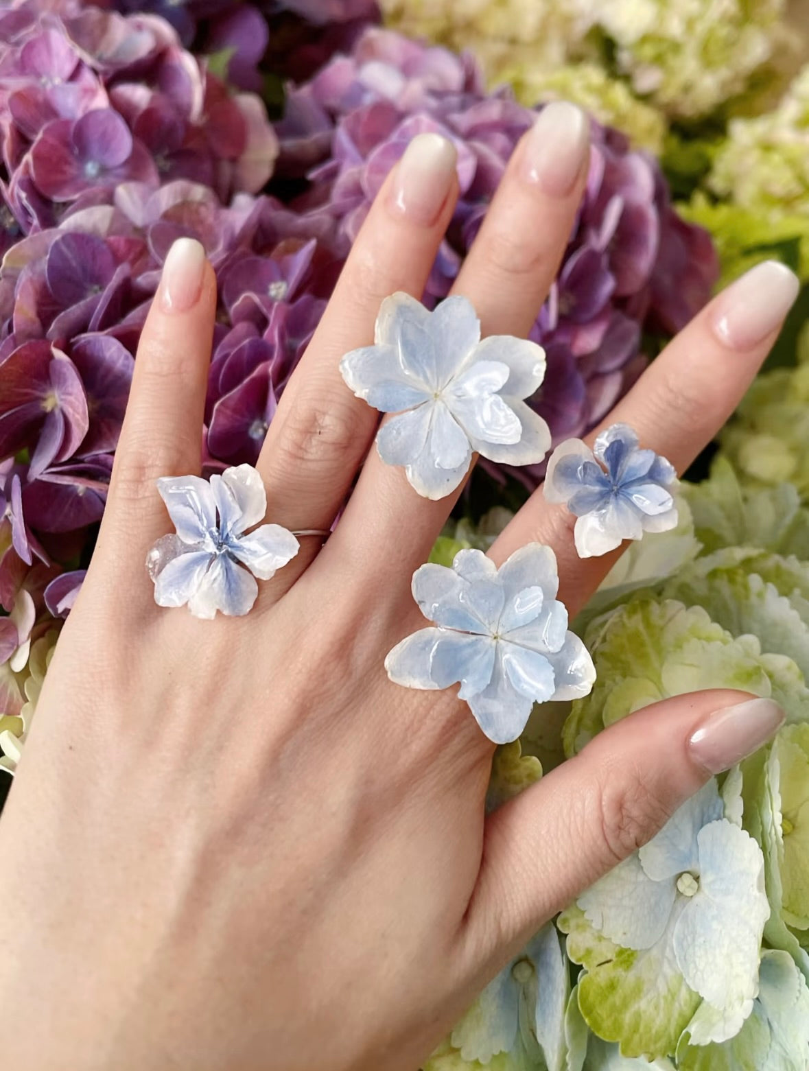 Hydrangea Blue hydrangea ring with resin flower petals and adjustable gold-tone band by Terra Decode